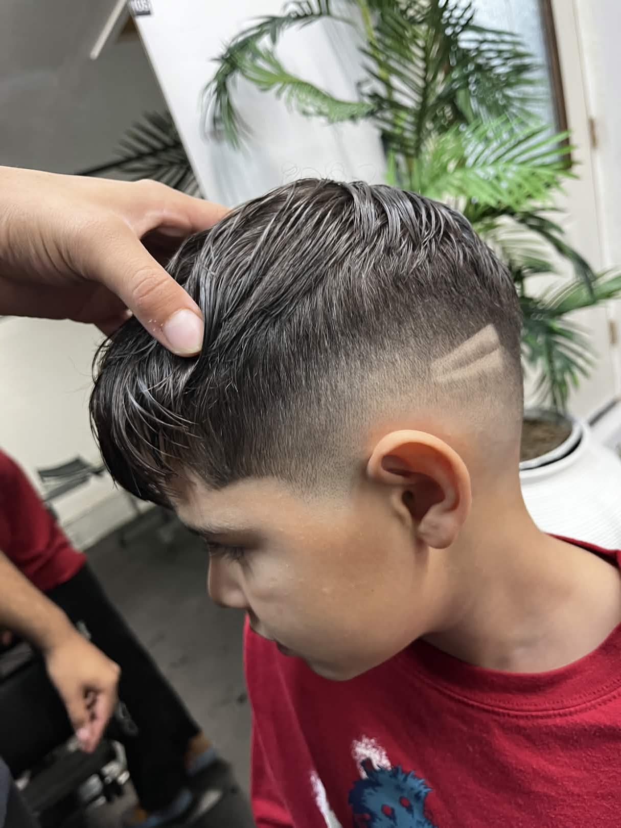 Speciality kids haircut with fade and razor detail by Carvajal Trims in Calgary