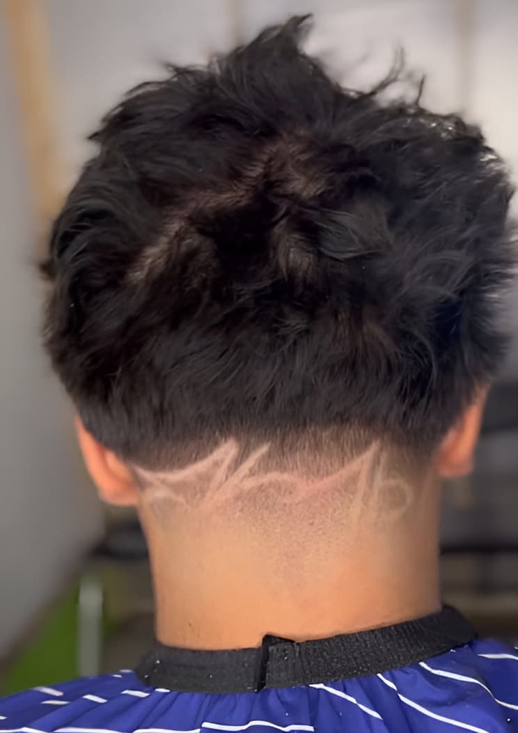 Neckline razor design haircut by Carvajal Trims barber in Calgary, Alberta