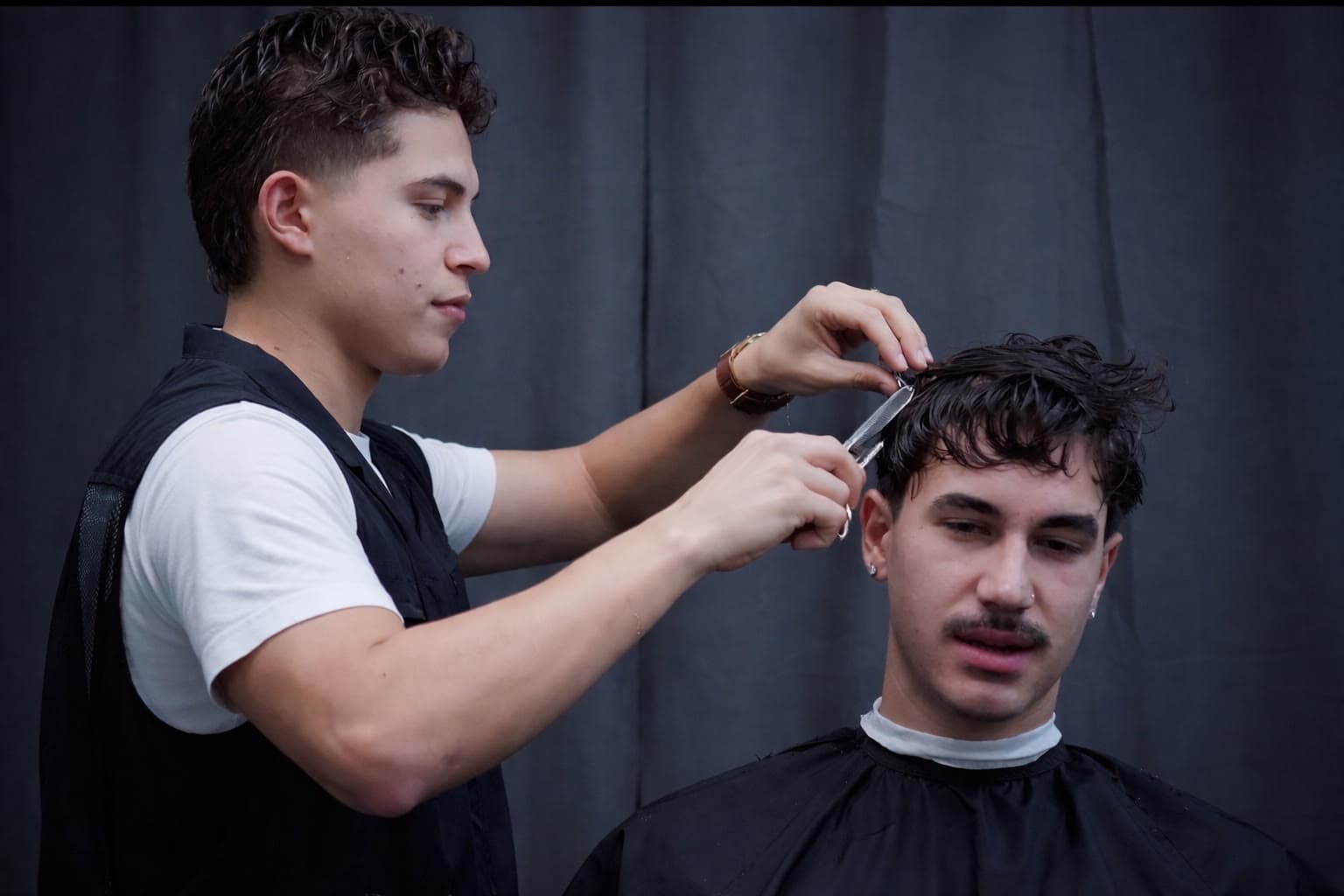 Sebastian Carvajal cutting a client's hair at Carvajal Trims in Calgary